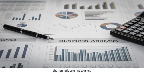 Business Graphs And Charts Report With Pen, Calculator On Desk Of Financial Advisor. Financial Abstract Concepts.