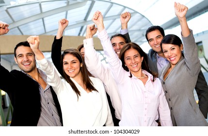 Business Group With Arms Up Celebrating Their Success