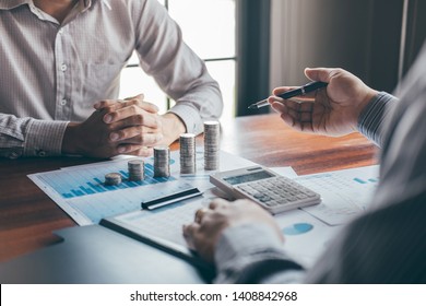 Business group brainstorming on meeting to planning project finance analyzing calculate with report document, stacking coins for step up growing business to profit and saving with wealth management. - Shutterstock ID 1408842968