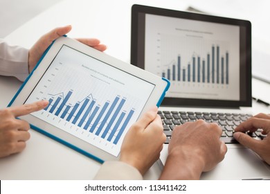 Business group monitoring profit dynamics in the company - Powered by Shutterstock