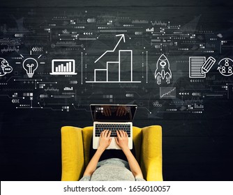 Business growth analysis with person using a laptop in a chair - Shutterstock ID 1656010057