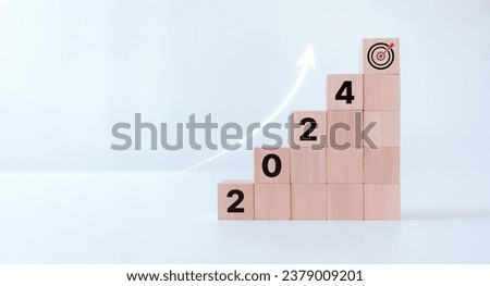 Business growth concept in 2024. Wooden cubes inscribed 2024 and target icon on white background. Business goal and achievement. Sustainable development. Positive indicator banner. Business challenge.