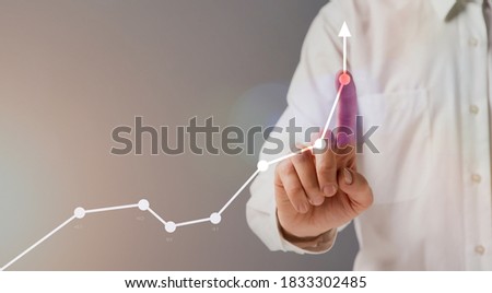 Business Growth Concept. Unrecognizable businessman pointing at financial graph with rising arrow as a symbol of economical success and company development, creative collage, panorama