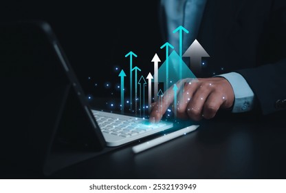 Business growth, Progress or success concept, Businessman use tablet showing a growing virtual hologram of analytics dashboard with charts, Stock market, Invest in trading, Finance, Marketing. - Powered by Shutterstock