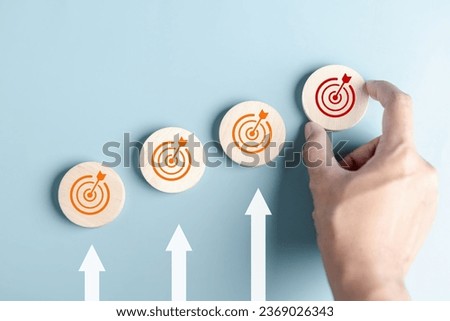 Business growth success achievement concept, arranging wooden block stacking as step stair or ladder for planning development leadership and customer target group concept.