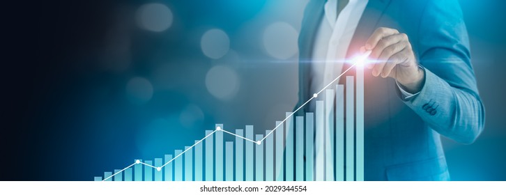 Business growth,boost up business or success concept.Businessman pointing arrow graph growth and financial network connection,analysing data to increase sales and revenue profit in global economic. - Shutterstock ID 2029344554