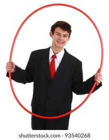 A business guy holding a hoop about to go through it, isolated on white
