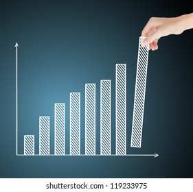 business hand building upward trend financial graph