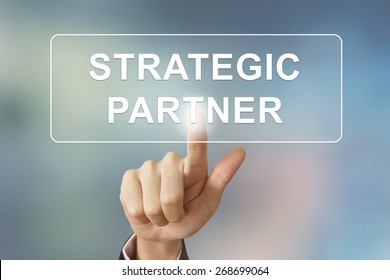 Business Hand Pushing Strategic Partner Button On Blurred Background