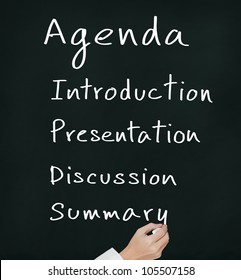 Business Hand Writing Meeting Agenda On Chalkboard