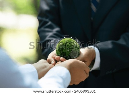 Business hands holding green Earth for Protecting Planet Environment and Earth Day. Responsibility of green business company. Ecosystem and Organization Development Cooperation.ESG and CSR. 
