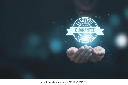 Business hands showing virtual guarantee tag label for giving the best quality of product and service to customer concept. - Shutterstock ID 2185472123