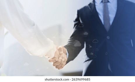 Business handshake between two professionals. Formal attire, business setting. Professional handshake symbolizes agreement, partnership, and cooperation in business. Business team and collaboration.