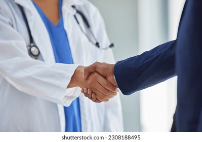 Business handshake and doctor partnership in a hospital with thank you and greeting gesture. Clinic, healthcare and professional deal shaking hands with agreement and contract success for b2b - Powered by Shutterstock