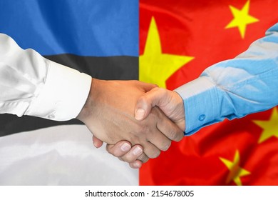 Business Handshake On Background Of Two Flags. Men Handshake On Background Of Estonia And China Flag. Support Concept