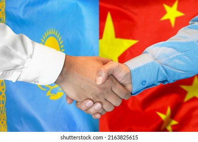 Business Handshake On Background Of Two Flags. Men Handshake On Background Of Kazakhstan And China Flag. Support Concept