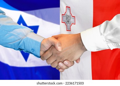 Business handshake on background of two flags. Men handshake on background of Israel flag and flag of Malta. Support concept - Shutterstock ID 2236171503