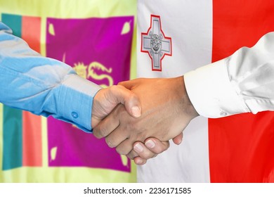 Business handshake on background of two flags. Men handshake on background of Sri Lanka flag and flag of Malta. Support concept - Shutterstock ID 2236171585