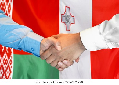 Business handshake on background of two flags. Men handshake on background of Belarus flag and flag of Malta. Support concept - Shutterstock ID 2236171729