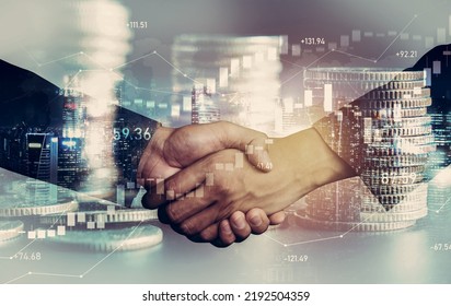 Business handshake on finance prosperity and money technology asset background . Economy and financial growth by investment in valuable stock market to gain wealth profit form currency trading - Shutterstock ID 2192504359