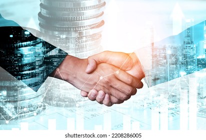 Business handshake on finance prosperity and money technology asset background . Economy and financial growth by investment in valuable stock market to gain wealth profit form currency trading - Shutterstock ID 2208286005