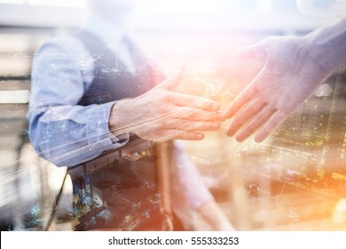 Business Handshake. Business Handshake And Business People Concept. Two Men Shaking Hands Over Sunny Office Background. Partnership, Deal