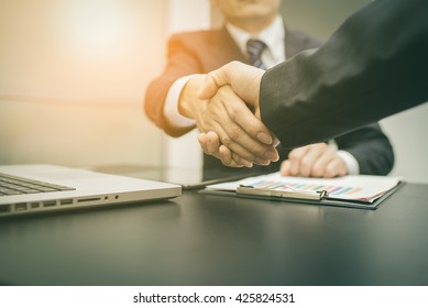 Business handshake and business people on deal concept. vintage tone.