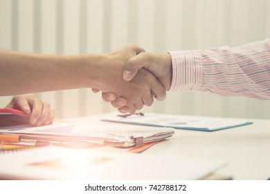 Business handshake and business people.Vintage tone ,soft focus.