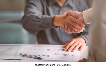 Business Handshake For Teamwork Of Business Merger And Acquisition,successful Negotiate,hand Shake,two Businessman Shake Hand With Partner To Celebration Partnership And Business Deal Concept