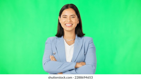Business, happy woman and face with arms crossed on green screen background for confidence. Portrait, smile and young female model, employee and empowerment of professional worker, happiness or pride - Powered by Shutterstock