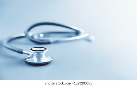 Business Health Care And Medical Check Up Concept. Stethoscope In Blue Tone Background With Copyspace. 