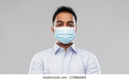 Business, Healthcare And People Concept - Portrait Of Indian Man In Shirt Wearing Face Medical Mask For Protection From Virus Disease Over Grey Background