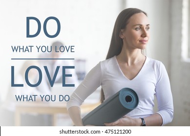 Business and healthy lifestyle concept. Portrait of beautiful sporty young office woman standing with yoga mat at workplace on break time. Motivational text "Do what you love, love what you do"