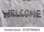 Business hello and welcome concept. Concept word Welcome written on beautiful ocean sand beach. Beautiful ocean sand beach background, copy space. Business hello and welcome concept.