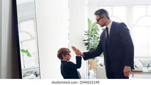 Business, high five or suit with father and son in living room of home for work experience. Motivation, role model or success with single parent man and boy child in apartment for morning routine - Powered by Shutterstock