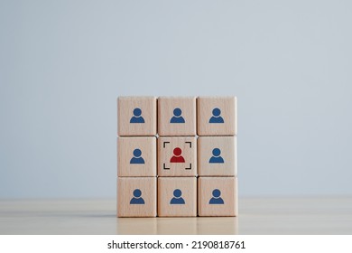 Business Hiring And Recruitment Selection. Career Opportunity. Human Resource Management. Hand Touching Focus Human Icon On Wooden Block. Choice Of Employee Leader From The Crowd.