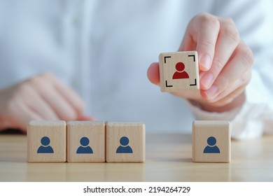 Business Hiring And Recruitment Selection. Career Opportunity. Human Resource Management. Finding Human. Hand Choosing Focus Red Human Icon On Wooden Block. Choice Of Employee Leader From The Crowd.