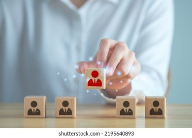 Business Hiring And Recruitment Selection. Career Opportunity. Human Resource Management. Finding Human. Hand Choosing Red Business Man Icon On Wooden Block. Choice Of Employee Leader.