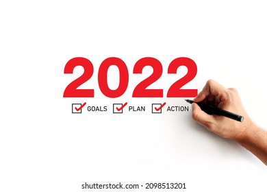 business improvement and change management. businessman draws a line between with old way 2021 and new way of the year 2022. space for text