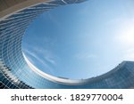 
business industrai city with mirror windows with reflections of blue sky with clouds lovely abstract modern circular building