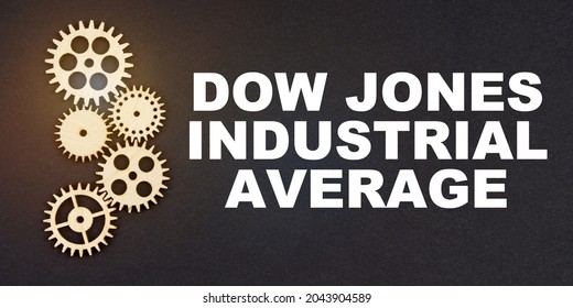 Business and industry concept. On a black background, gears and the inscription - Dow Jones Industrial Average