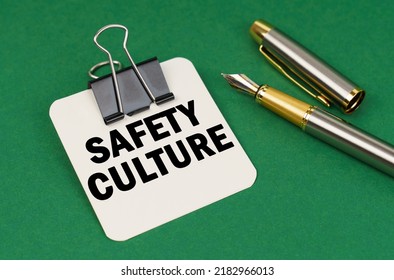 Business And Industry Concept. On A Green Surface, A Pen And A Sheet Of Paper With The Inscription - Safety Culture