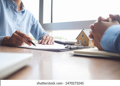 Business Insurance authorities showing an insurance policy and dealing the policyholder must to sign. - Shutterstock ID 1470273245