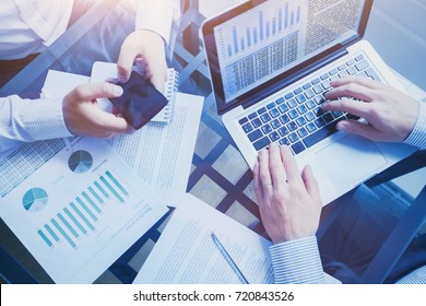 business intelligence concept, team of people working on charts and data, meeting in the office, graphs analysis - Powered by Shutterstock