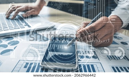 Business intelligence technology and big data analytic mixed media showing concept of futuristic information report using computer software to analyze strategic investment advice for decision making .