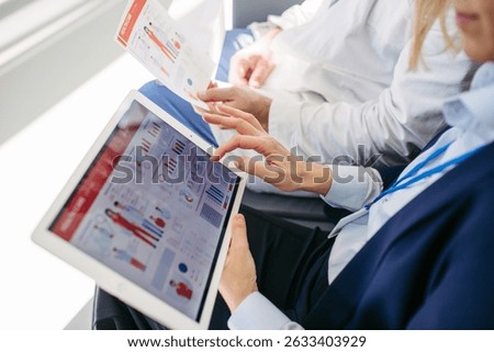 Business interaction between pharma rep and healthcare provider.