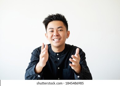 Business Interview. Professional Career. Project Management. Portrait Of Ambitious Cheerful Asian Man Speaking Smiling Looking At Camera Isolated On White Empty Space Background.