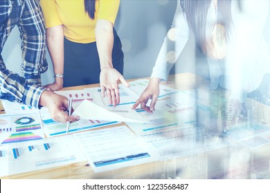 Business Investment Advisory Meeting Partner team A์alyzes Company's Annual Financial Statements.Balance Sheets Work With Graph Papers. Report Audit, TAX, Investment Analysis for Shareholders  - Powered by Shutterstock