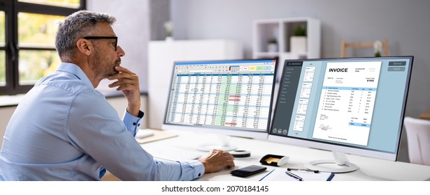 Business Invoice Tax Management. Accountant Using Monitor