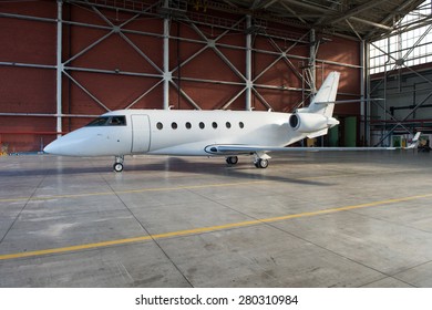 Business Jet Airplane Is In Hangar.